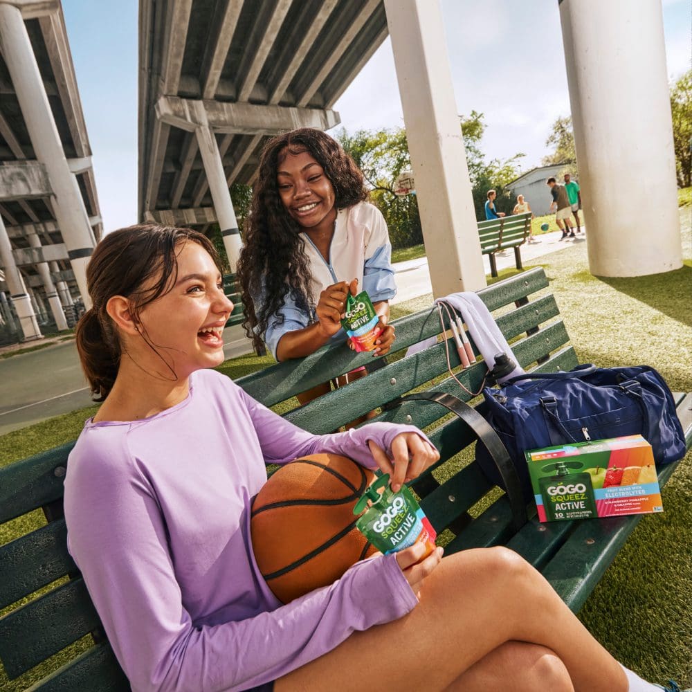 wholesale-image1 Teens playing basketball eating GoGo squeeZ Active With Electrolytes